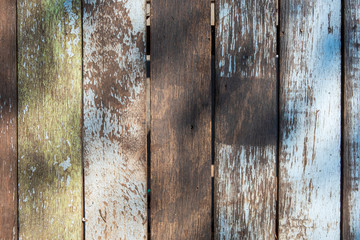 Old rough vertical wooden boards with scratches and faded paint. texture and background.