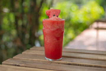 fresh watermelon smoothie on wood table