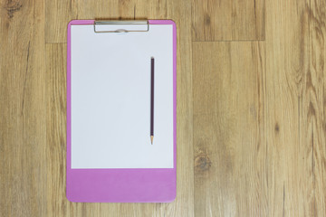 Clipboard on table with copy space.