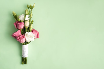 Bouquet of eustoma Flowers pink and white isolated on green background 