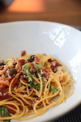 Dried Chili and Bacon Spaghetti on wood background