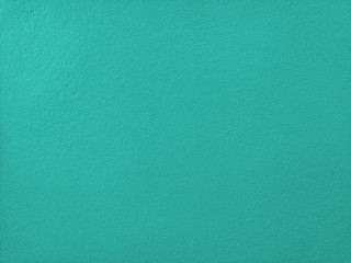 Concrete  mint  wall  background  with  copy  space.