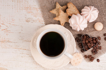 cup of coffee and cookies on wooden table