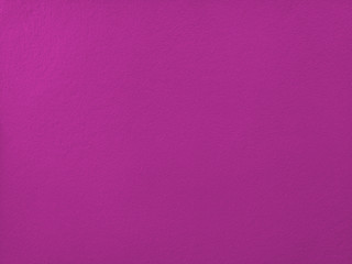 Concrete  mauve  wall  background  with  copy  space.
