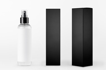Mock up for design of packing cosmetics product - tall transparent spray bottle, white label and...