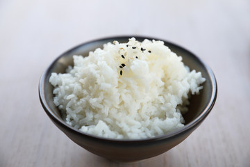 Rice with wood background in close up