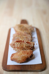 Fried chicken on wood background