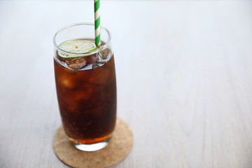 Cola close up on wood background