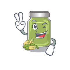 mascot of funny pistachio butter cartoon Character with two fingers