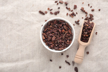 Cacao nibs background with space