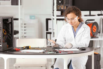 Electronic technician working in service center