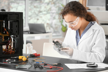 Electronic technician working in service center