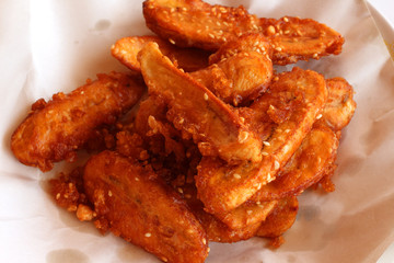 Close up Thai snack sweetened fried banana fritters.