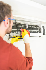 Aircondition service and maintenance, fixing AC unit and cleaning the filters.