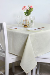 white plates on the festive table. serving in bright colors.