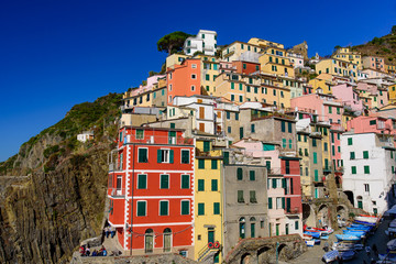Fototapeta na wymiar Riomaggiore, one of the five Mediterranean villages in Cinque Terre, Italy, famous for its colorful houses
