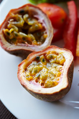 Passion fruit on white plate