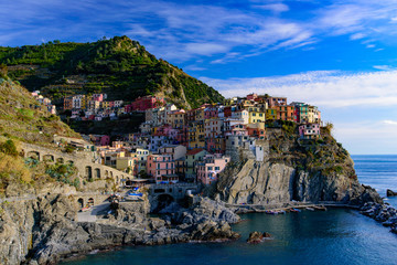 Fototapeta na wymiar Manarola, one of the five Mediterranean villages in Cinque Terre, Italy, famous for its colorful houses and harbor