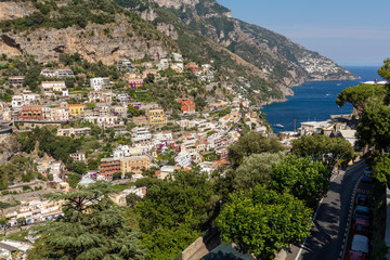 Naklejka na ściany i meble Panorama of Positano with houses climbing up the hill, Campania, Italy