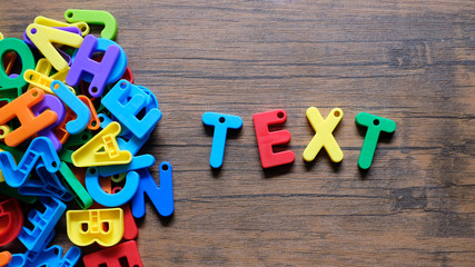'Text colorful word on the wooden background