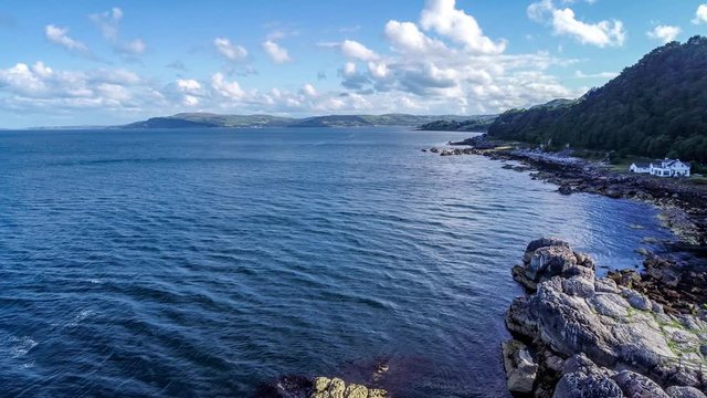 Atlantic coast, Northern Ireland. Garron Point. Geological formation, parking and marina at Causeway Coastal Route. One of the most scenic coastal roads in Europe. Aerial video