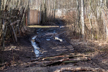 Rural dirt road after winter