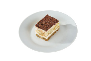 Fototapeta na wymiar Rectangular piece of Tiramisu on a white plate, isolated on white background. Dessert for a menu in a cafe, restaurant, coffee shop side view