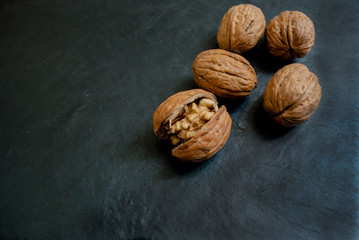 walnuts lie on a black background