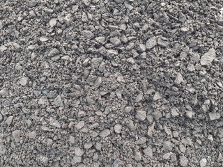 Black and grey coal background. Texture of coal mixed with soil