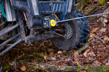 Fototapeta na wymiar The winch is coupled with a buggy that slid into a ditch during extreme riding