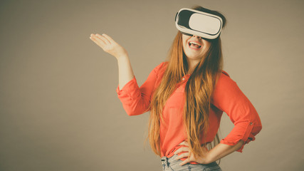 Girl wearing virtual reality goggles.