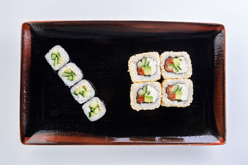 sushi rolls in a plate on a light background set