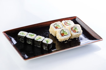 sushi rolls in a plate on a light background set