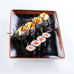 sushi rolls in a plate on a light background set