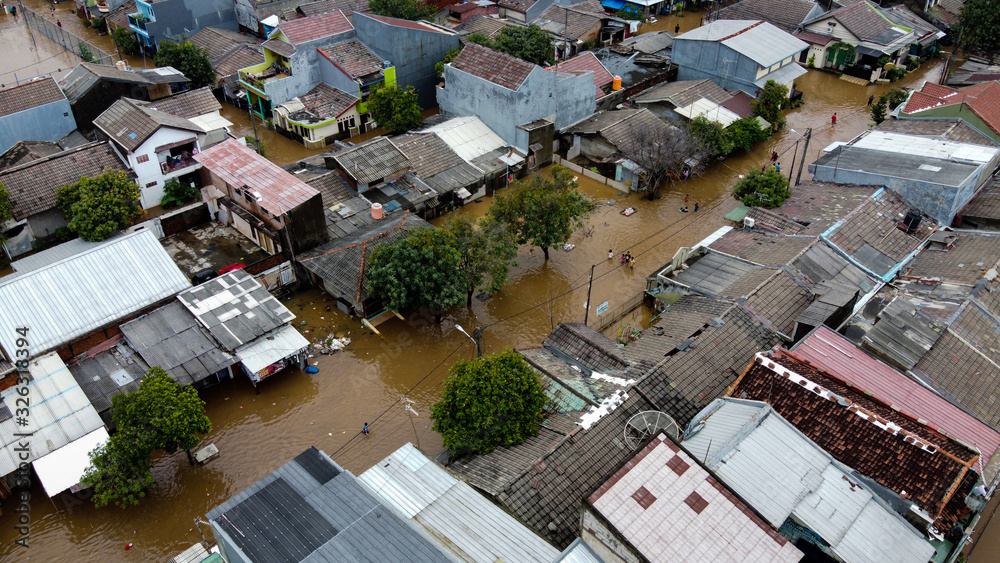 Wall mural Aerial POV view Depiction of flooding. devastation wrought after massive natural disasters at Bekasi - Indonesia - Wall murals