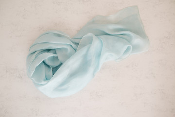 close up of a sil scarf - pastel tone - bright blue color