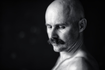 unusual portrait of a bald mustachioed young gentleman, eccentric mister, psychology concept
