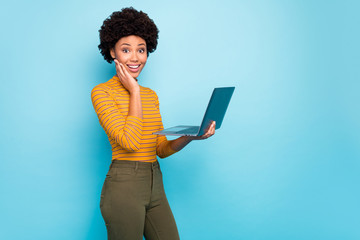 Profile photo of pretty dark skin curly lady hold notebook hands reading good news modern...