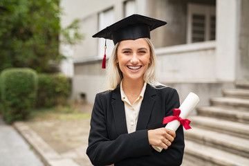 Happy graduate student wearing graduation cap