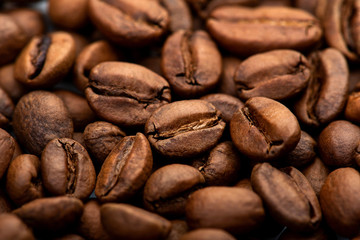 Obraz na płótnie Canvas Coffee beans close-up background. Fresh roasted