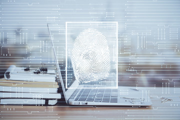 Computer on desktop in office with finger print drawing. Double exposure. Concept of business data security.