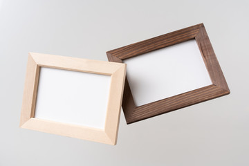 top view of two brown wood photo frame on white