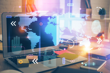 Multi exposure of table with computer and world map hologram. International data network concept.