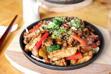 Stir fried chicken and mixed vegetables with teriyaki sauce served on a sizzling plate.