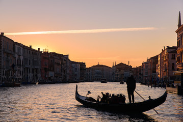 Silhouette of gondola on the Grand Canal at sunrise / sunset time, Venice, Italy