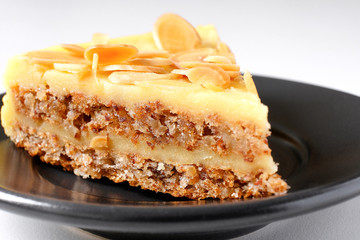 Culinary sweets. Cake with nut shavings. Dessert.