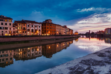 Obraz premium Pisa Italy 11/03/2018: Pisan lungarnos, adorned with wonderful buildings and bridges are the most picturesque and famous places in Pisa, and among the most romantic for sure.Pisa Tuscany Italy