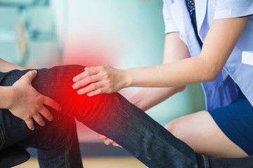 Men come to consult a doctor with knee pain.