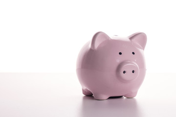 Pink pig piggy bank on a white background. The concept of savings and savings, financial management