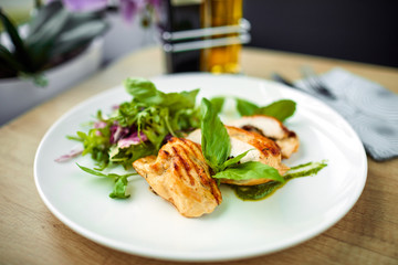 grilled chicken breast and salad